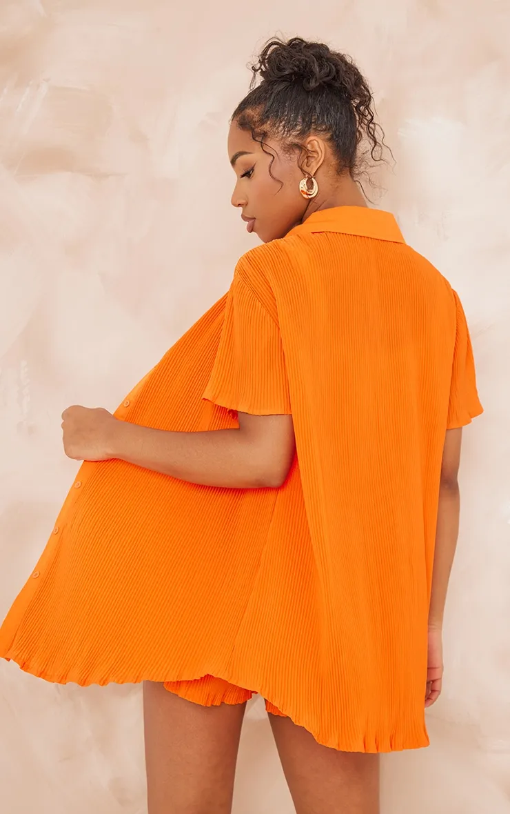 Chemise oversize plissée orange vif à manches courtes et boutons