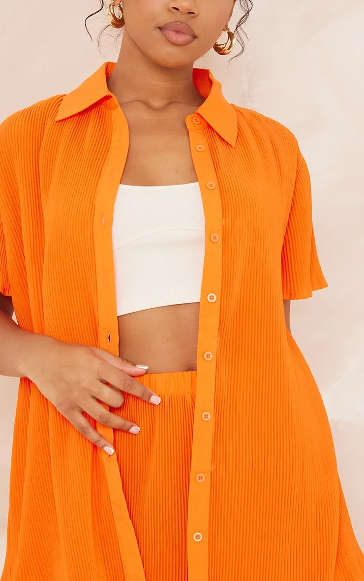 Chemise oversize plissée orange vif à manches courtes et boutons