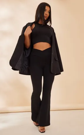 Pantalon flare en crêpe noir à taille croisée